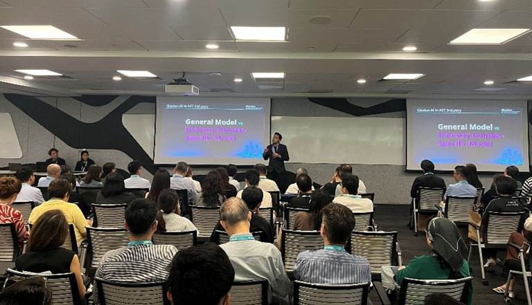 Dr. Nazirul Fariq addressing the audience on the importance of domain-specific AI for construction, part of Glodon’s Three-High strategy.